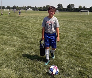 Kid at soccer camp